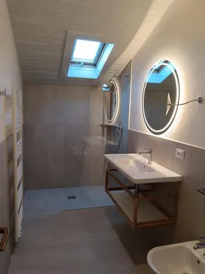 a bedroom with a bed with towels on it at Residence Lenzenau in Tirolo