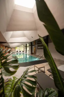 a hallway with a room with a living room and a room with a room at Hotel Pollinger in Merano