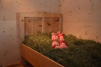 a pile of apples in a barn with hay at Naturchalet in San Vigilio Di Marebbe