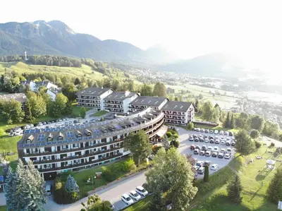 an aerial view of a hotel with a parking lot at Veronza Clubresidence in Cavalese
