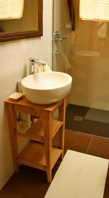 a bathroom with a white sink and a shower at Hütterhof Passeiertal in San Martino