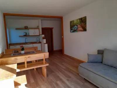 a living room with a couch and a table at Stuberhof in Rifiano