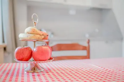 a tray of apples and bread on a table at Residence krUma in Valdaora