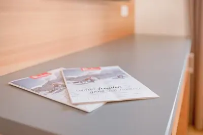 a magazine sitting on top of a counter at Residence krUma in Valdaora