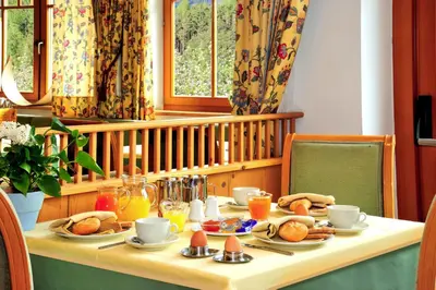 a table with food and drinks on it at Hotel Flötscherhof in Naz-Sciaves