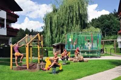 a group of children playing on a playground at Hotel Flötscherhof in Naz-Sciaves