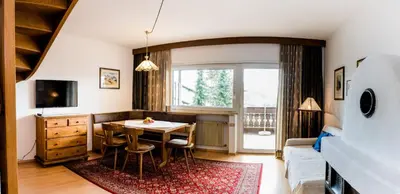a living room with a table and a window at Apartment Matilde in Vols am Schlern