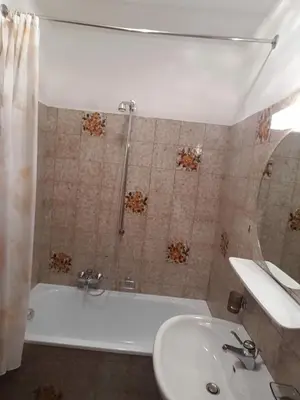 a bathroom with a shower and a sink and a tub at Apartment Matilde in Vols am Schlern