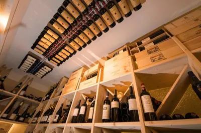 a room filled with lots of bottles of wine at Hotel Grien in Ortisei