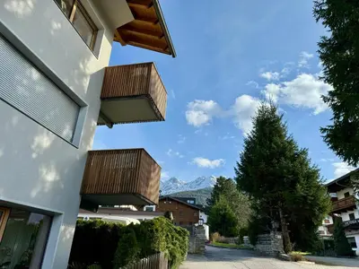 a house with two balconies on the side of it at Da Renata in Valdaora