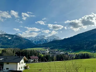 a village in a valley with mountains in the background at Da Renata in Valdaora