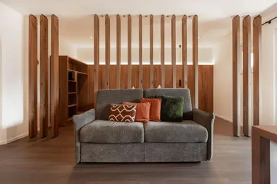 a couch with pillows on it in a living room at Gran Tubla in Ortisei