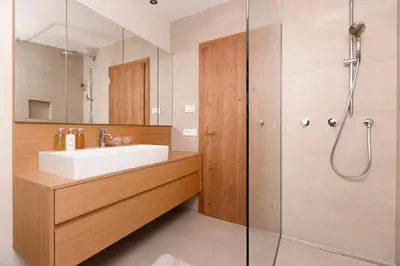 a bathroom with a sink and a shower at Gran Tubla in Ortisei