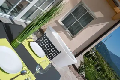a computer desk with a keyboard and a computer monitor at Gutshof Rellich in Termeno