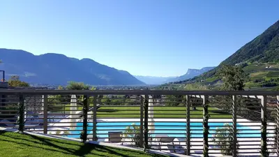 a view of a river with mountains in the background at The View Luxury Suites in Lagundo