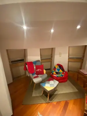 a living room with a couch and a table at Villa Alessandra in Colle Isarco