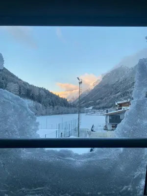 a window with a view of a snow covered field at Villa Alessandra in Colle Isarco