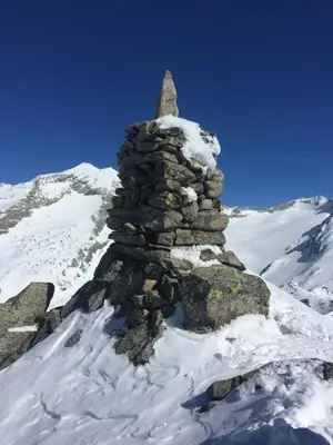 a stone tower on top of a snow covered mountain at Chalet Schmied in Terento