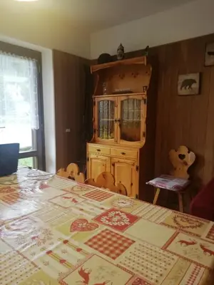 a dining room table with a christmas quilt on it at CasaMau Trilo in Campitello di Fassa