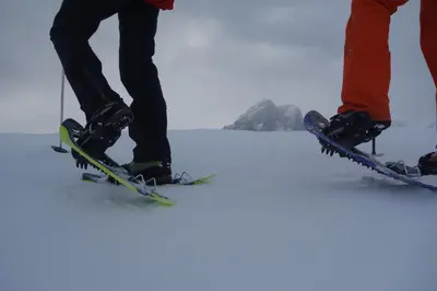 three people are standing on skis in the snow at Ciasa Medalghes in San Martino in Badia