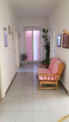 a living room with a couch and a chair at Casa da Aldo in Castelfondo