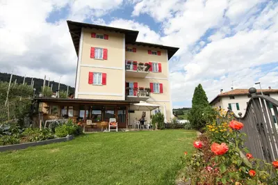 a large building with a yard in front of it at Casa da Aldo in Castelfondo