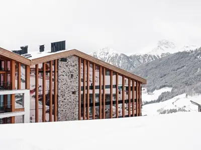 a rendering of a ski lodge with mountains in the background at Hotel Panoramic Lotsch in Sarntal