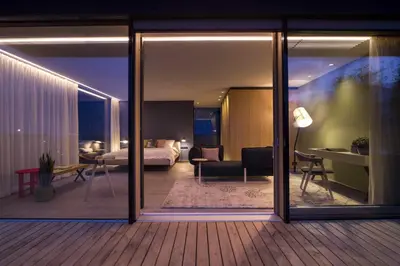 a hotel room with a view of a bedroom at Muchele Boutique Hotel in Postal