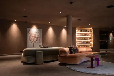 a living room with a couch and a table at Muchele Boutique Hotel in Postal