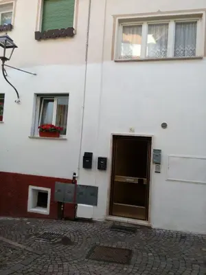 a building with a door on the side of it at Casa Trettel in Tesero