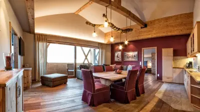 a kitchen and dining room with a table and chairs at Widmannhof - Urlaub auf dem Biobauernhof in Bressanone