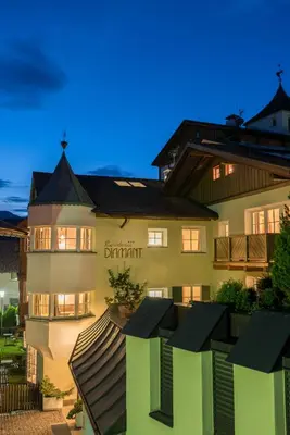 a building with a sign on the side of it at Residence Diamant in Castelrotto