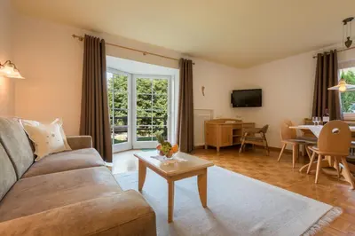 a living room with a couch and a table at Residence Diamant in Castelrotto