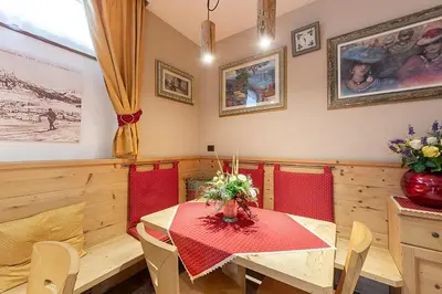 an overhead view of a dining room with two tables at Monza Dolomites Hotel in Moena
