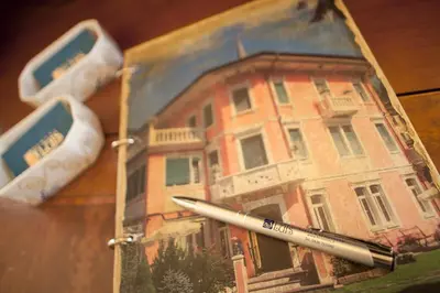 a picture of a painting of a house with a pen at Hotel Luis in Fiera di Primiero