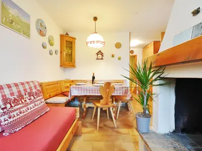 a living room with a table and a couch at Apartment Monti Pallidi by Interhome in Campitello di Fassa