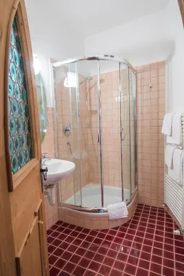 a bathroom with a shower and a sink at Jagerhof in Caldaro
