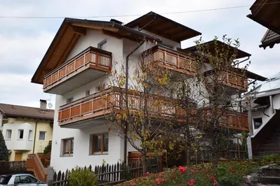 a building with balconies on the side of it at Aurturist Valdaora Roulette in Valdaora