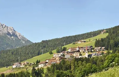 a small village on a hill in the mountains at Aurturist Valdaora Roulette in Valdaora