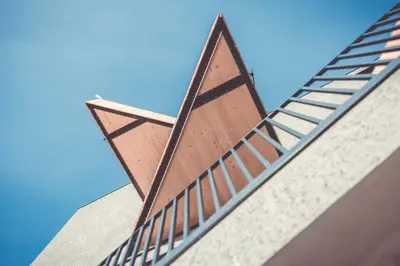 a ladder on the side of a building at Spaces Hotel in San Vigilio Di Marebbe