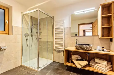 a bathroom with a shower and a sink at Apartments Milanhof in Ortisei