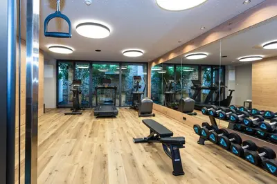 a gym with treadmills and elliptical machines at Avidea - Adults Only in Lagundo