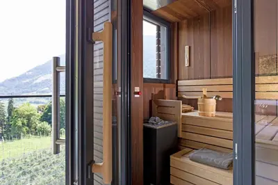 a room with a view of a vineyard through a window at Avidea - Adults Only in Lagundo