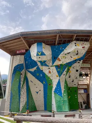 a large indoor bouldering wall in a building at Casa Fiemme Panchià in Panchia