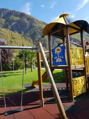 a playground with a slide in a park at Haus Winkler in Vilpiano
