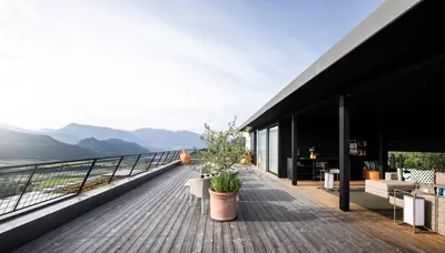 a house with a view of the mountains at Designhotel Gius La Residenza in Caldaro