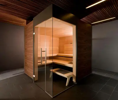 a glass closet with a bench inside of it at Designhotel Gius La Residenza in Caldaro