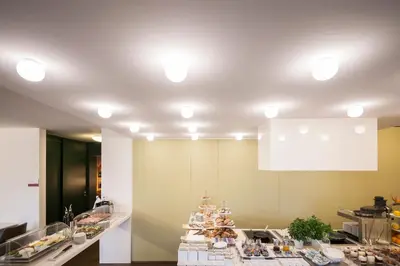 a kitchen with a counter with food on it at Designhotel Gius La Residenza in Caldaro