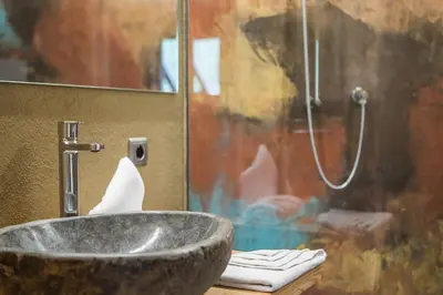 a bathroom with a sink and a shower at Bike & Ski Hotel Diana Karersee in Nova Levante