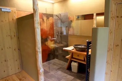 a bathroom with a shower and a sink at Bike & Ski Hotel Diana Karersee in Nova Levante